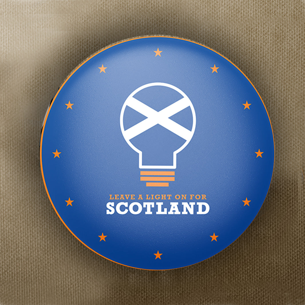 National - Leave A Light On Pin Badge